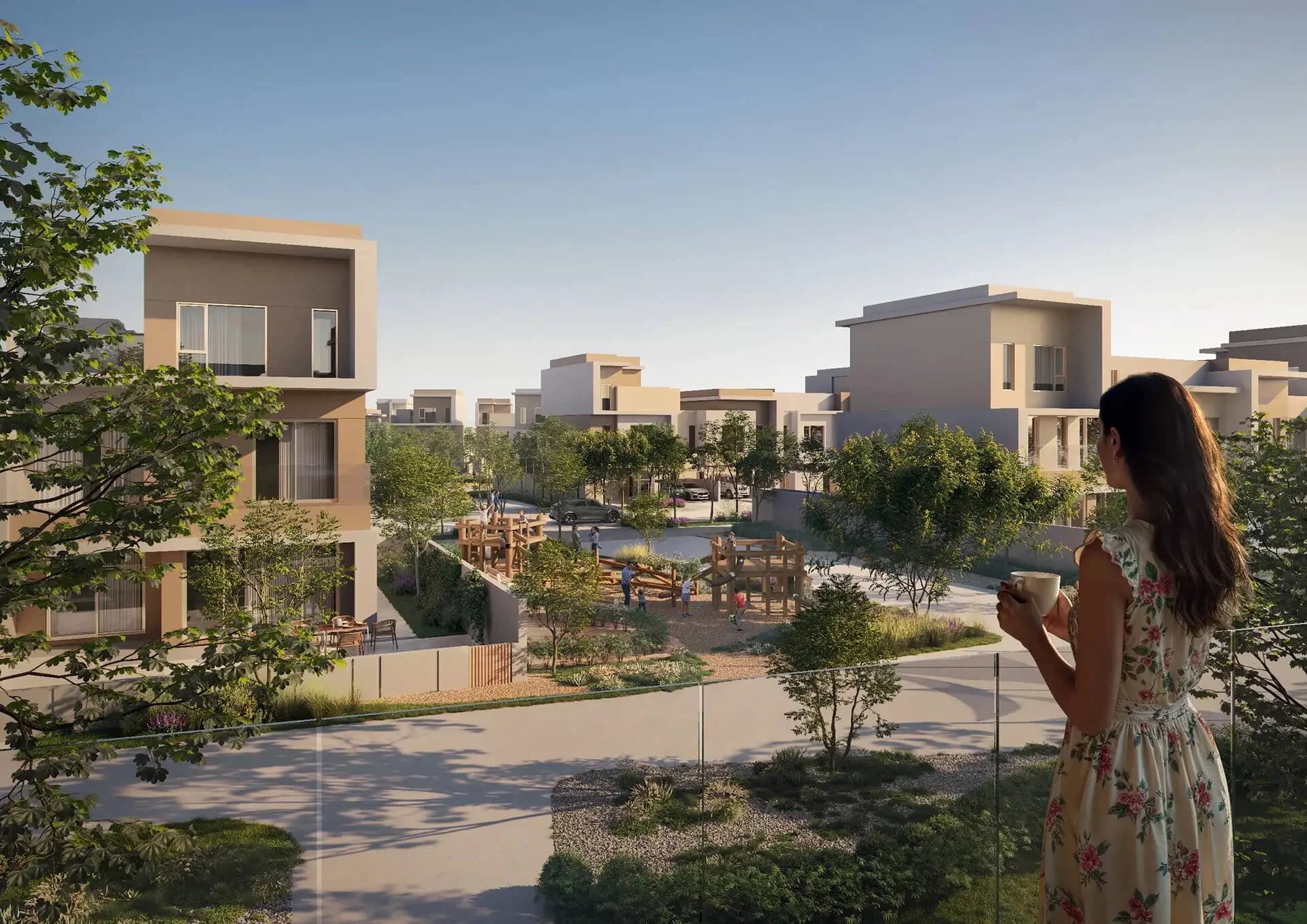Park-facing townhome community with playground amenity at Bayn by Ora, Ghantoot, between Abu Dhabi and Dubai