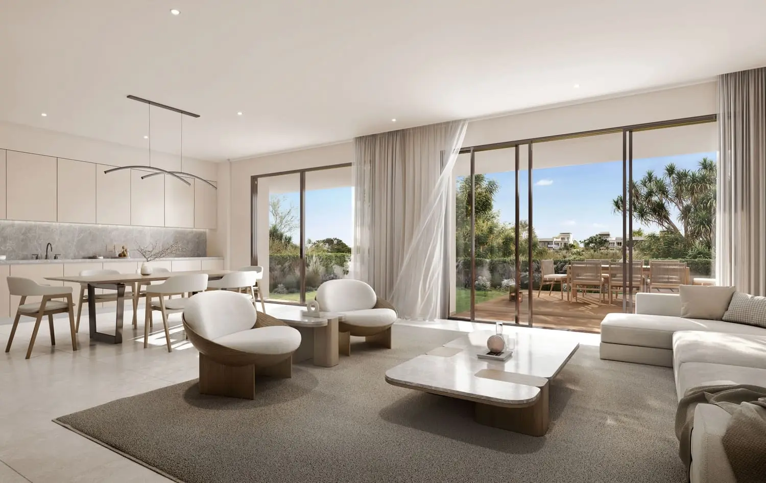 Townhome open-plan living kitchen flowing to a terrace at Bayn by Ora, Ghantoot, between Abu Dhabi and Dubai