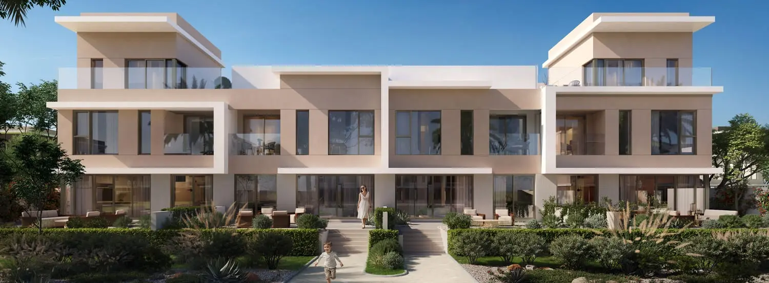 Park-facing townhouse facade beside landscaped paths at Bayn by Ora, Ghantoot, between Abu Dhabi and Dubai