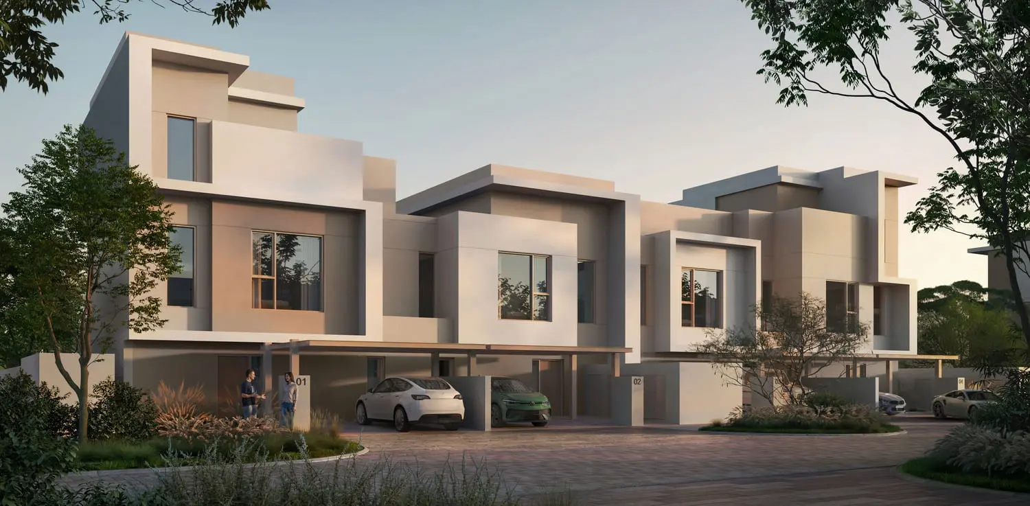 Townhouse row exteriors along a landscaped driveway at Bayn by Ora, Ghantoot, between Abu Dhabi and Dubai