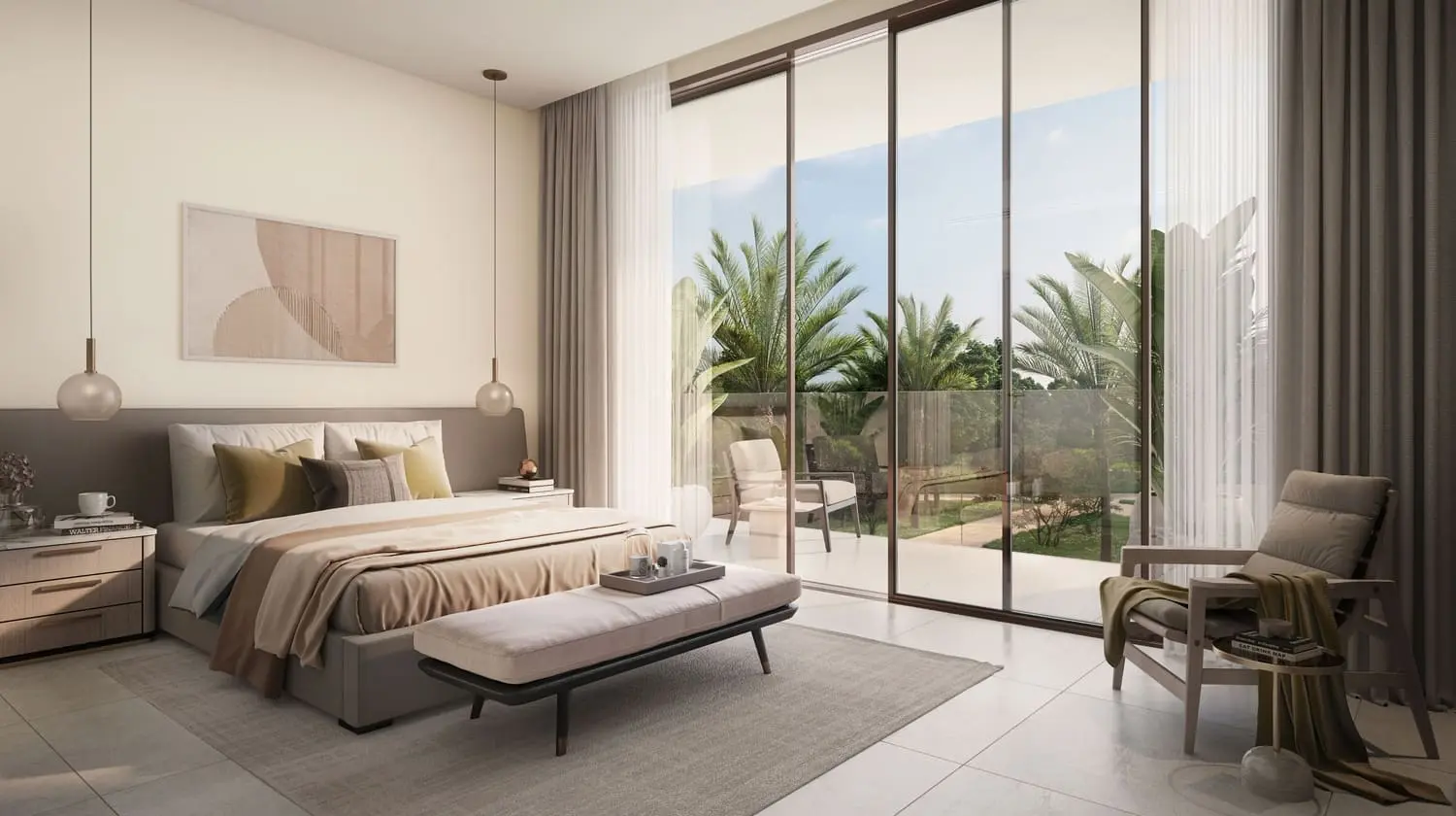 Bedroom with floor-to-ceiling garden balcony at Bayn by Ora, Ghantoot, between Abu Dhabi and Dubai