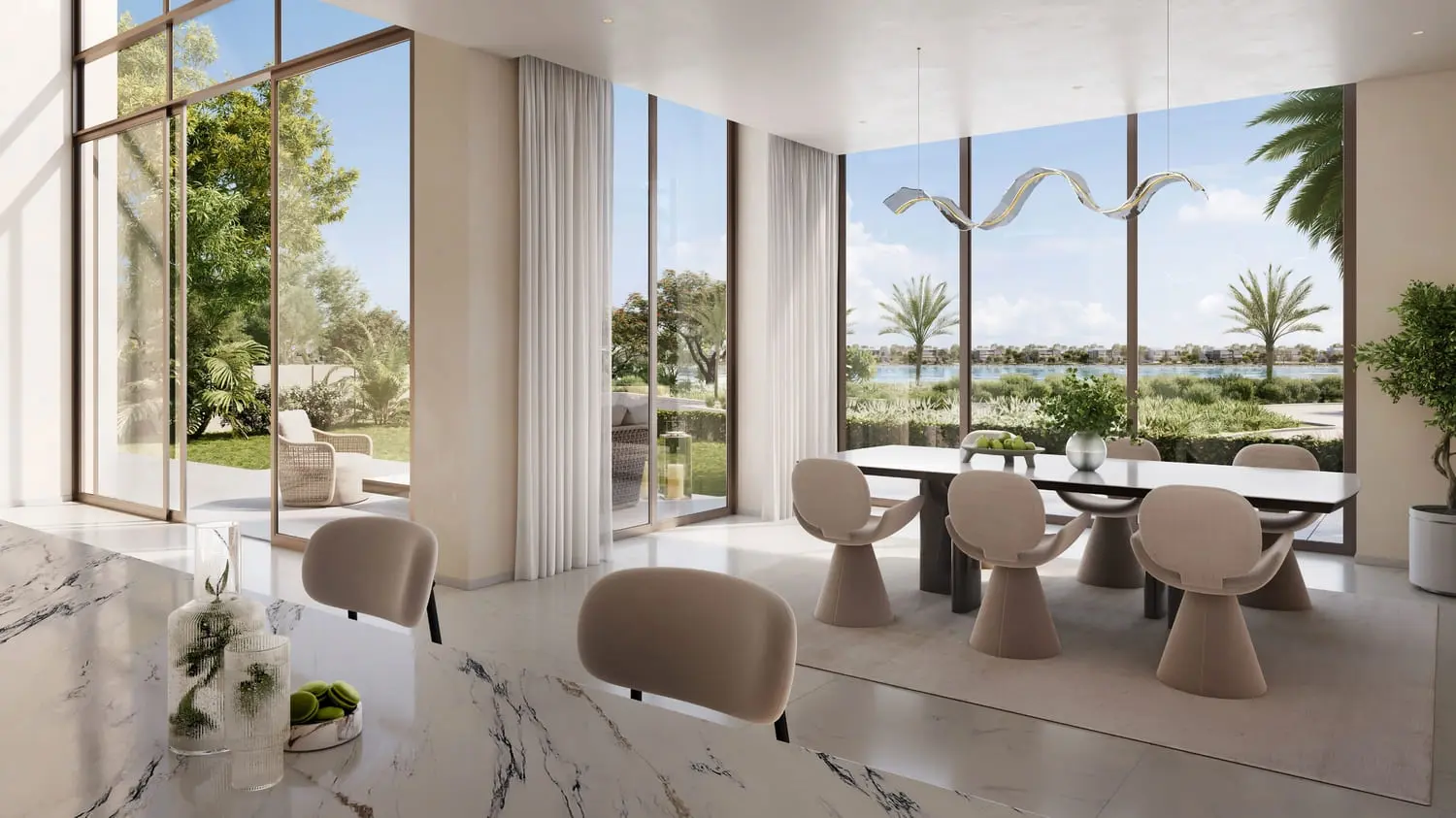 Dining and kitchen interior with lagoon outlook at Bayn by Ora, Ghantoot, between Abu Dhabi and Dubai