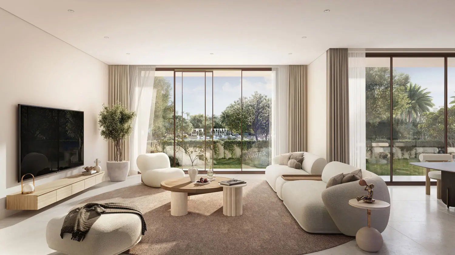 Villa living room overlooking landscaped gardens at Bayn by Ora, Ghantoot, between Abu Dhabi and Dubai