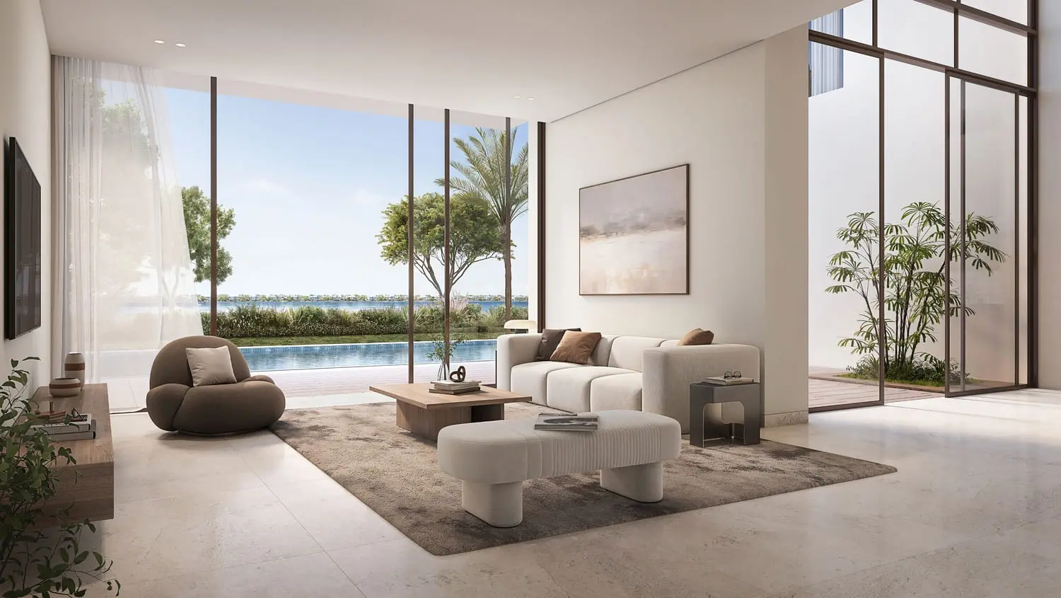 Villa living room opening to pool and lagoon views at Bayn by Ora, Ghantoot, between Abu Dhabi and Dubai