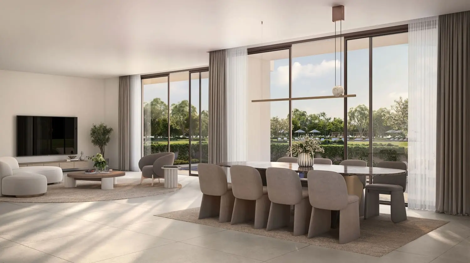 Open-plan living and dining with garden outlook at Bayn by Ora, Ghantoot, between Abu Dhabi and Dubai