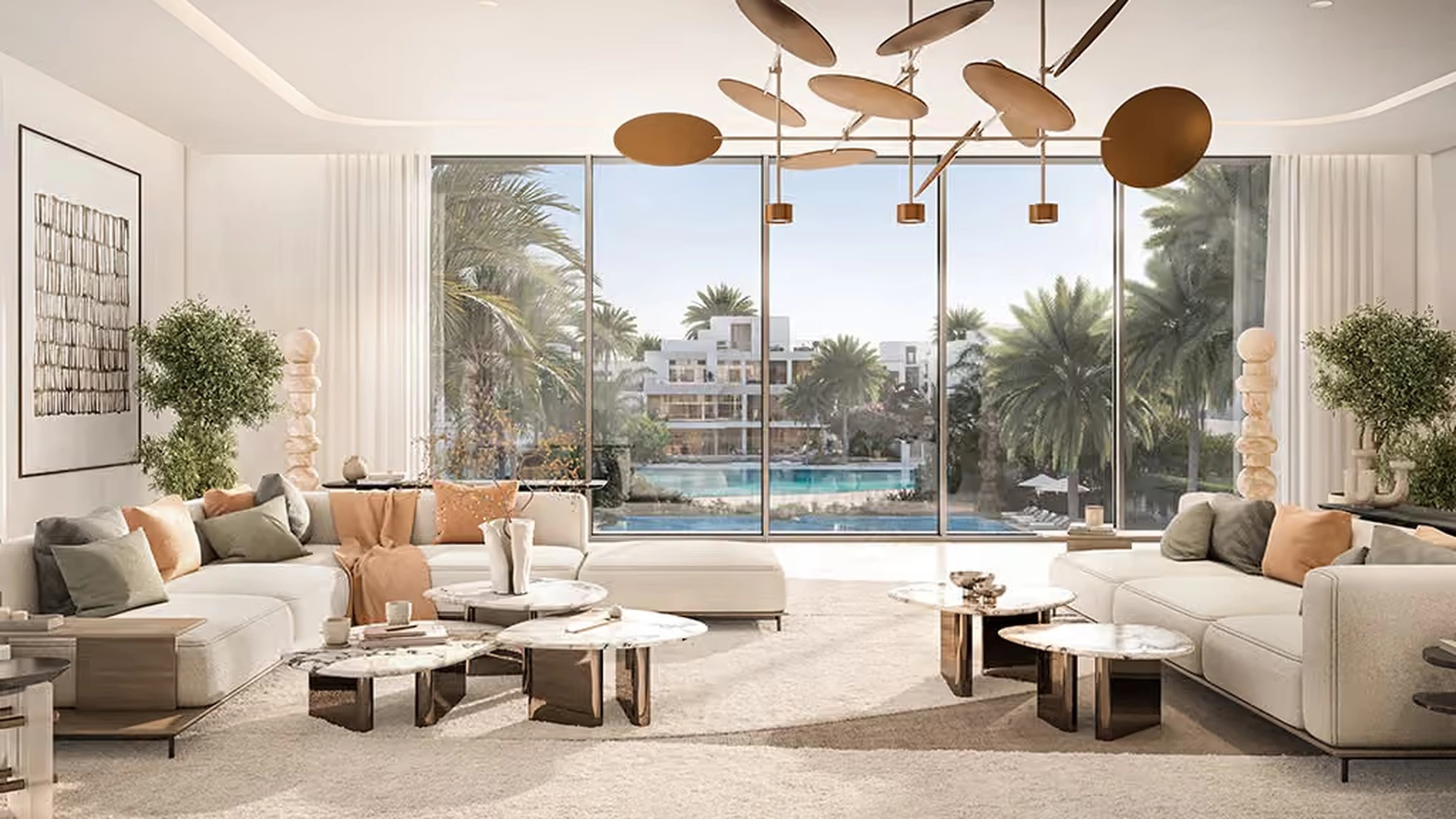 Mirage living room with lagoon and palm tree views
