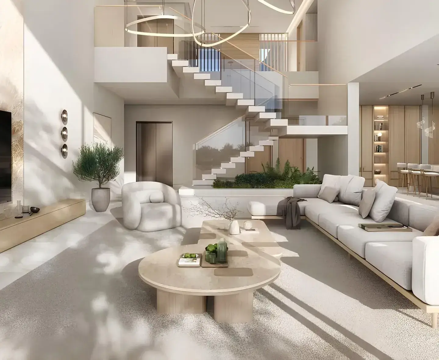 Double-height living room with floating staircase at Y Views at Bayn, Ghantoot, between Abu Dhabi and Dubai