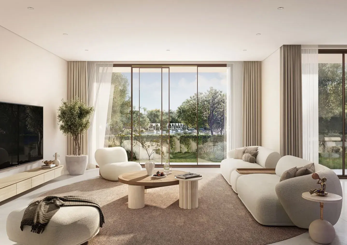 Living room with garden view through glass doors at Y Views at Bayn, Ghantoot, between Abu Dhabi and Dubai