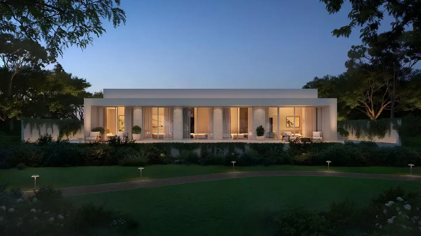 Villa exterior at twilight with a garden path at Y Views at Bayn, Ghantoot, between Abu Dhabi and Dubai